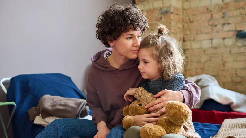 women and her child in a homeless shelter